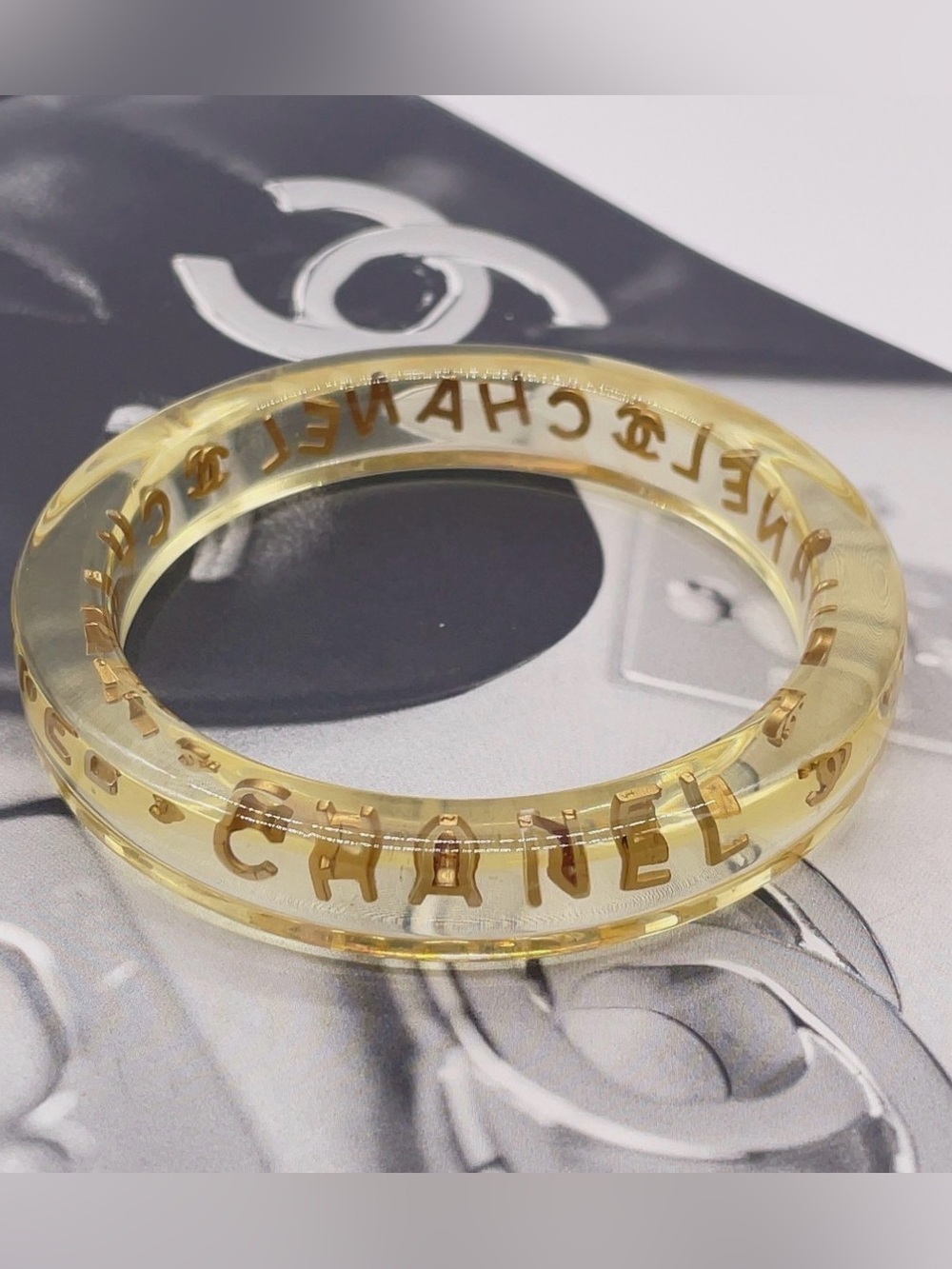 CHANEL LUCITE & Gold Letter Clear Acrylic Bangle - Picture 3 of 12